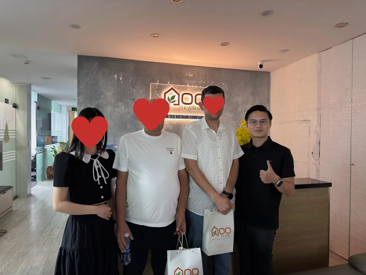 Customers at the Goo Farm reception desk during a visit to the Hanoi office